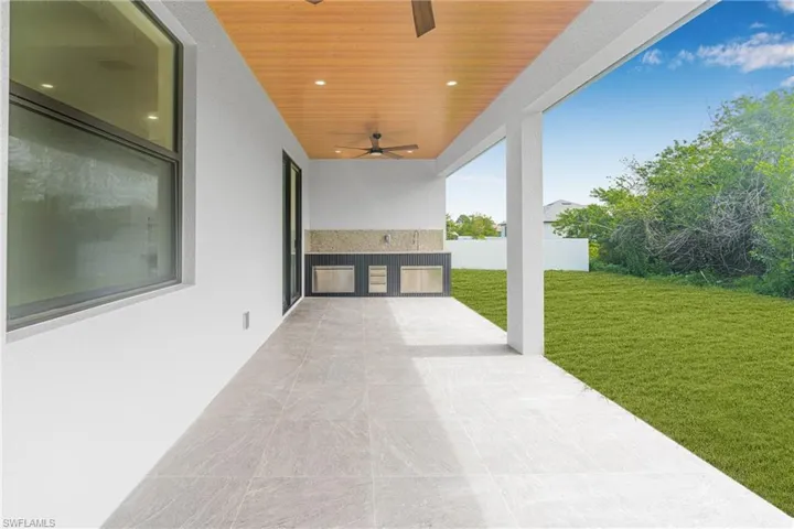 View of patio / terrace with ceiling fan and area for grilling