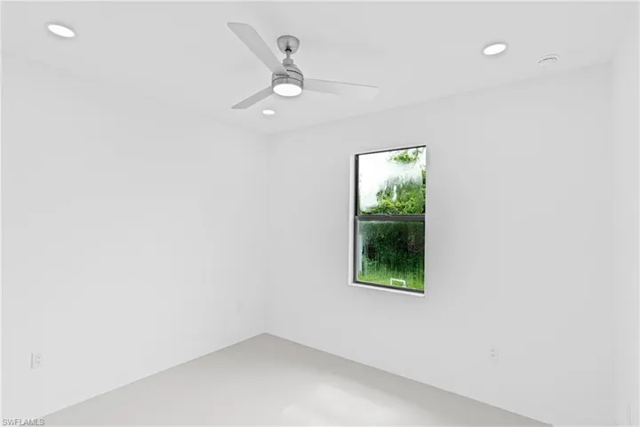 Unfurnished room with recessed lighting and a ceiling fan