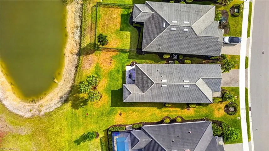 Aerial perspective highlighting a property with a lakefront boundary