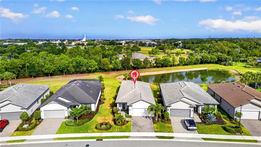 Contemporary single-story residence with a gray tile roof and a paved driveway