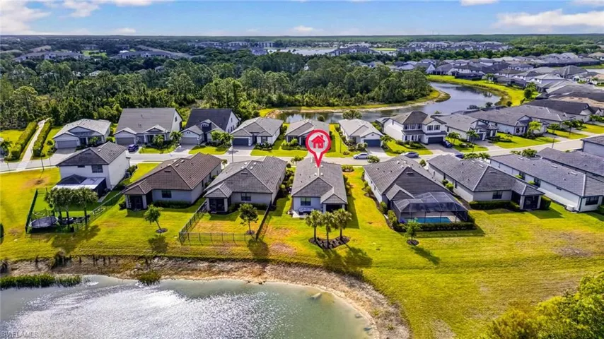 Waterfront property featuring a private backyard, mature landscaping, and a spacious lot