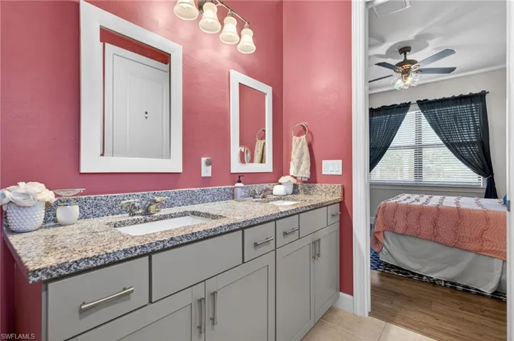 Dual vanity with granite-style countertop and undermount sinks