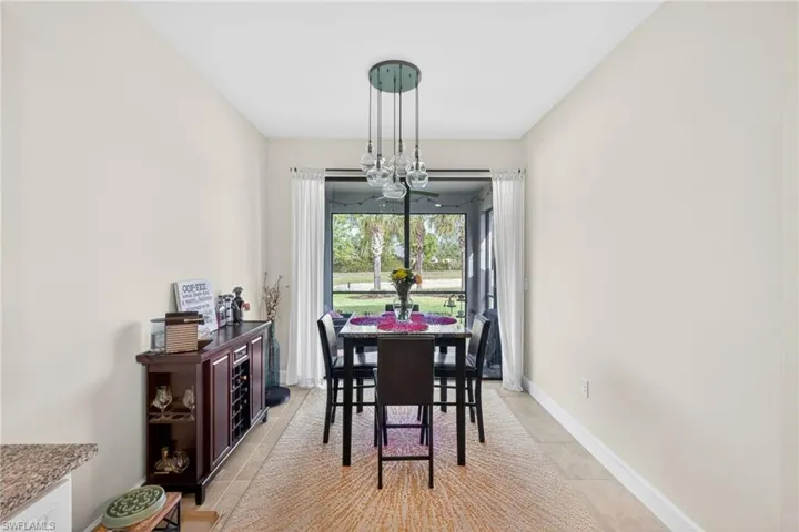 Dining area with neutral wall tones and tile flooring