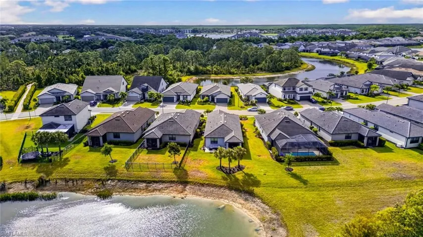 Aerial perspective showcasing a residential community with waterways and natural landscaping