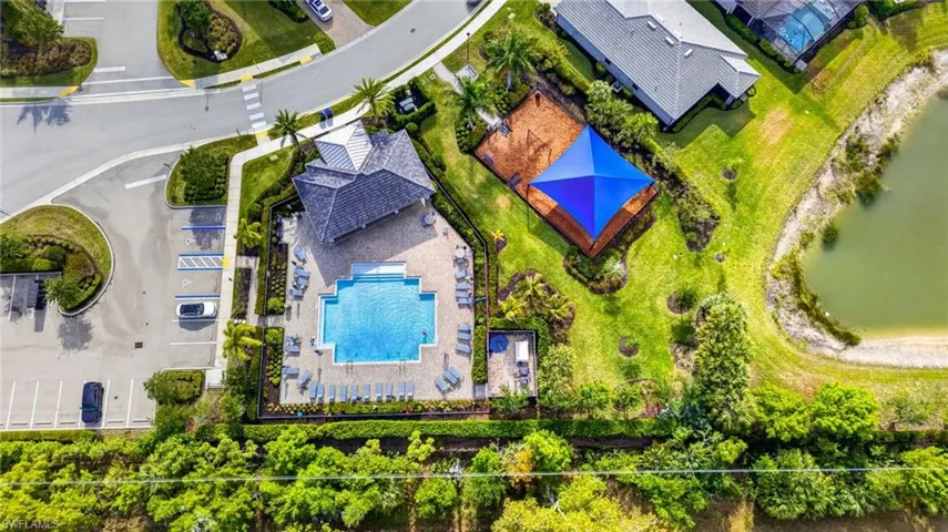 Community amenities featuring a swimming pool, covered pavilion, and dedicated play area