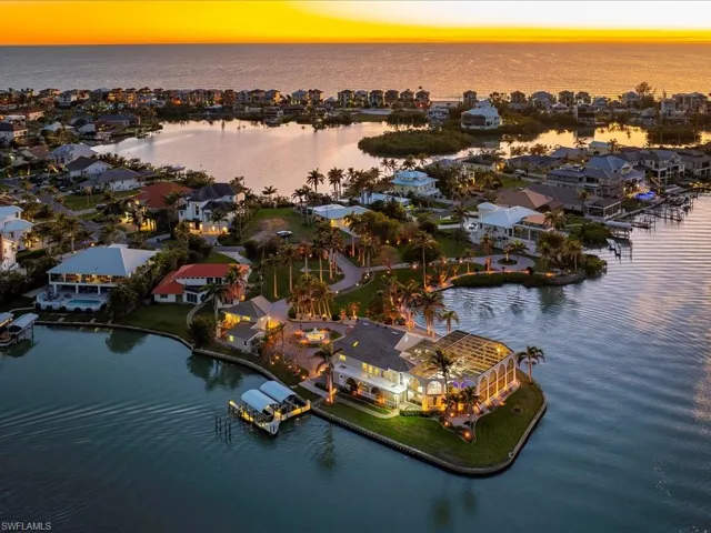 Aerial view featuring a residential view and a water view