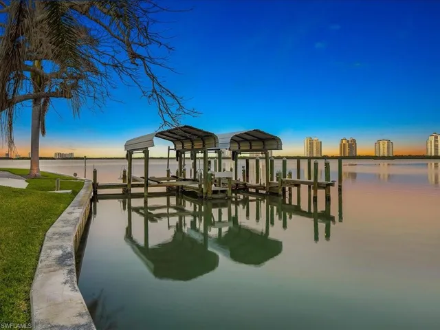 Dock area featuring a water view and boat lift