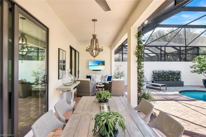 View of patio featuring an outdoor living space and a lanai
