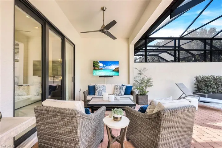View of patio / terrace with a lanai, an outdoor hangout area, and ceiling fan
