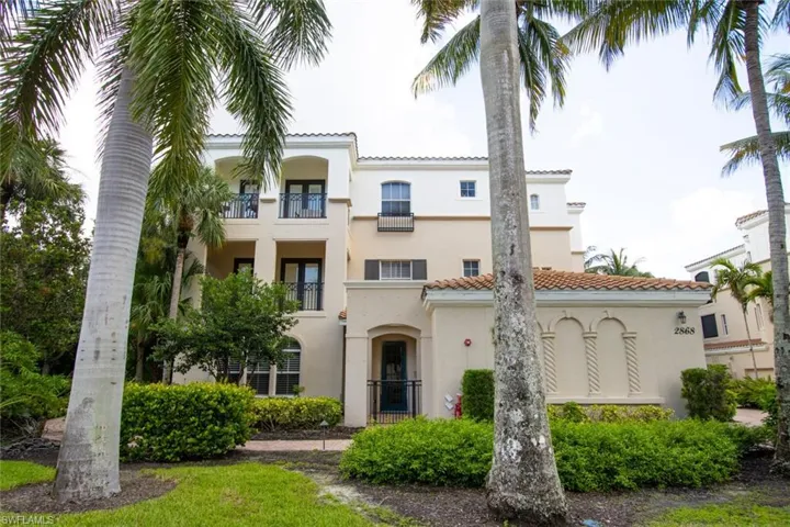 View of front of home featuring a tile roof and stucco siding