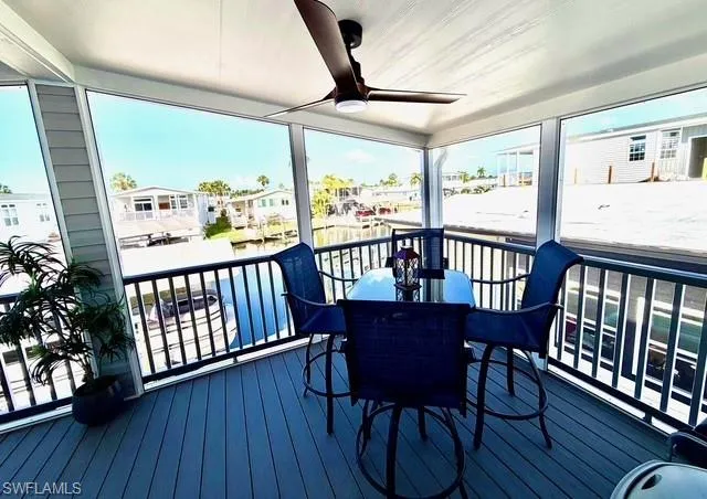 Deck featuring ceiling fan, a residential view, and outdoor dining space