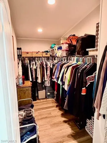 Walk in closet featuring light wood-type flooring