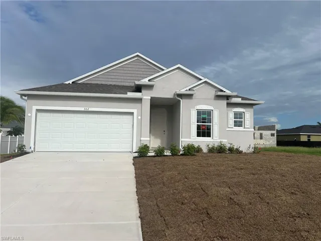 View of front of property with a garage