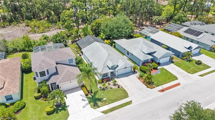 Aerial perspective showcasing a residential street with multiple single-family homes