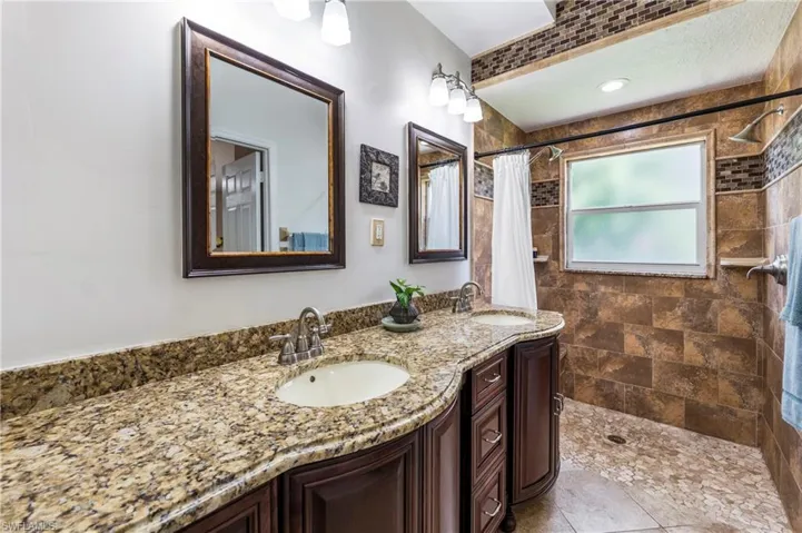 Dual vanity with granite countertop and integrated sinks