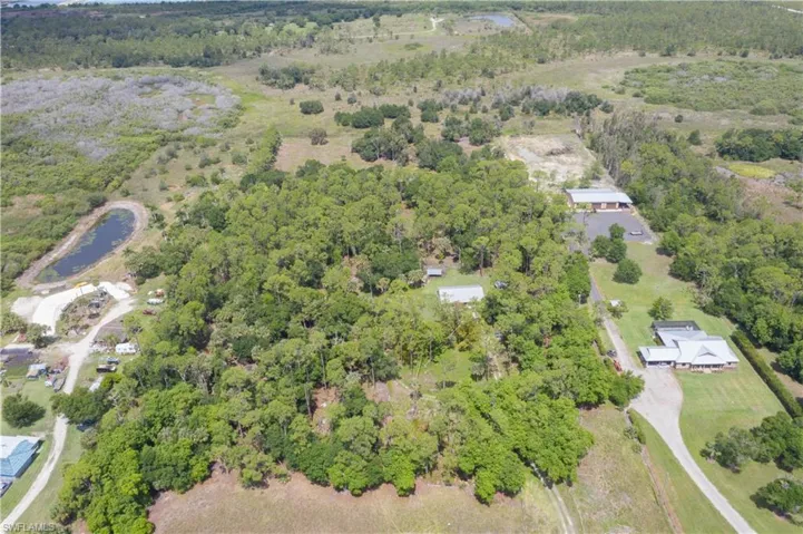 Aerial overview of property's location with a large body of water
