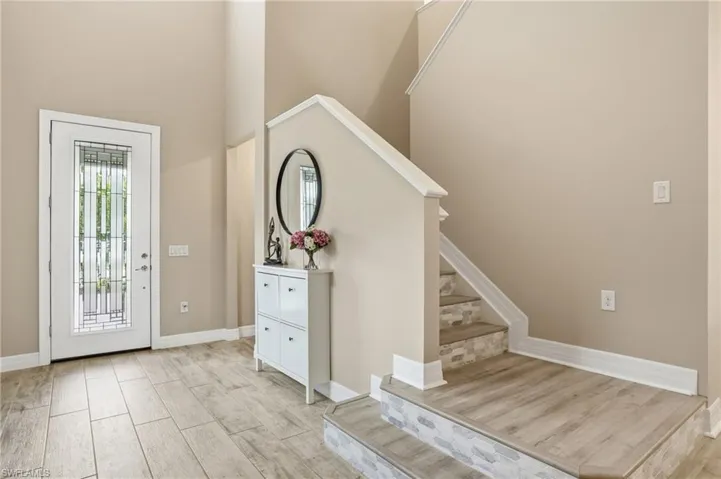 Foyer leads into the main living area- over to the garage and first floor bed on the other side.