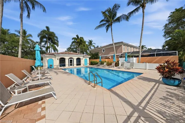 Rectangular swimming pool with integrated steps and a surrounding paver deck