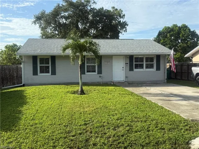 View of front of property featuring roof with shingles