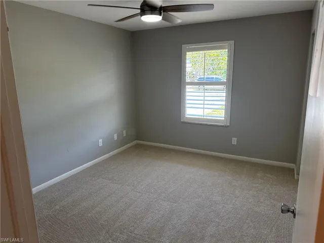Carpeted spare room, plantation shutter with ceiling fan and wall mounting for 55" Flatscreen TV