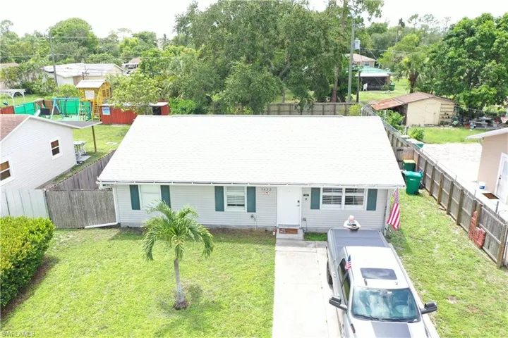 View of front of home featuring a fenced backyard