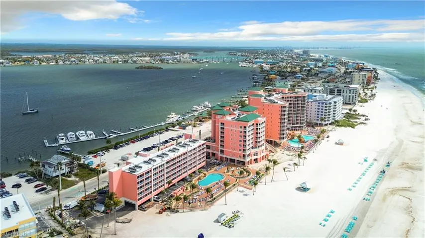 Birds eye view of property with a water view