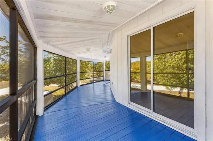 Unfurnished sunroom featuring a deck