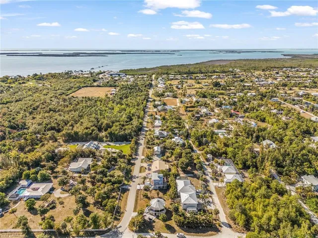 View of property location with nearby suburban area and a large body of water