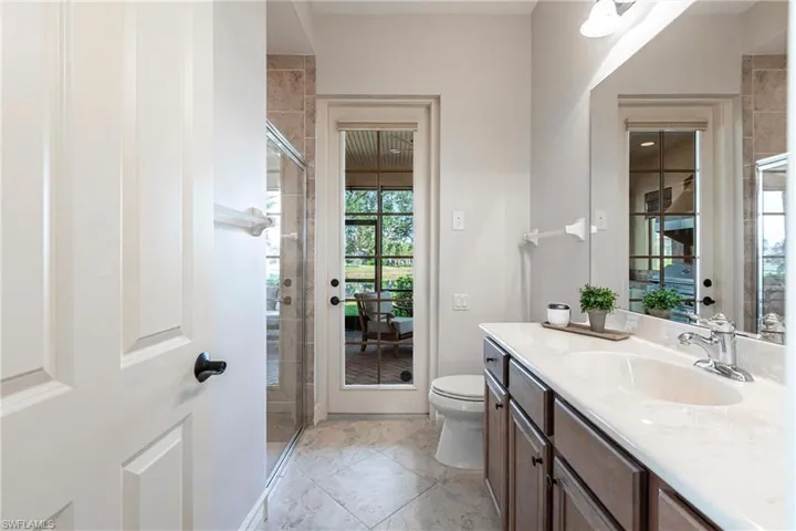 Guest quarters bath to pool and outdoor kitchen and seating area