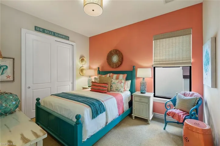 Bedroom featuring carpet floors and a closet