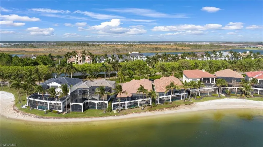 Drone / aerial view featuring a water view and a view of the beach