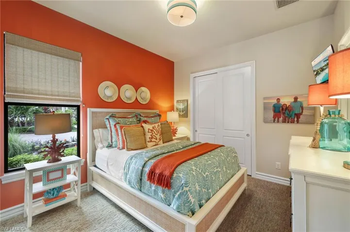 Carpeted bedroom featuring a closet