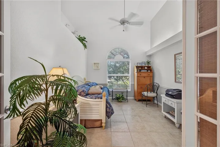 Bedroom 3 or den - high ceiling, fan window