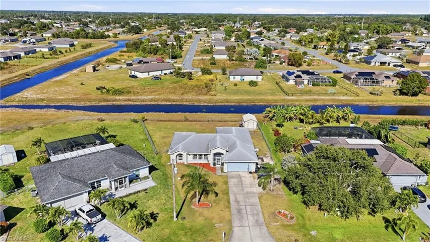 View of property location featuring nearby suburban area and a nearby body of water
