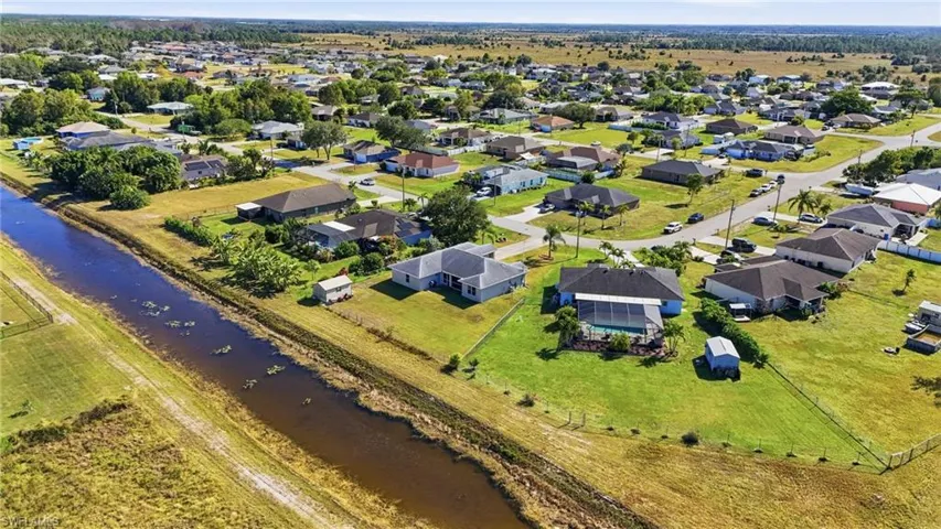 Aerial overview of property's location featuring a large body of water