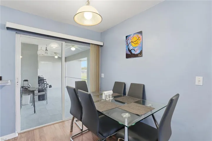 Dining area featuring wood finished floors and ceiling fan
