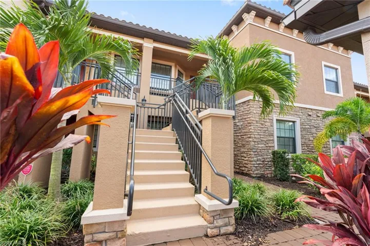 View of property featuring stairway