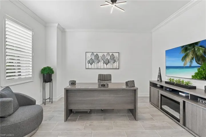 Recessed lighting, crown molding, plantation shutters, and large format tile flooring