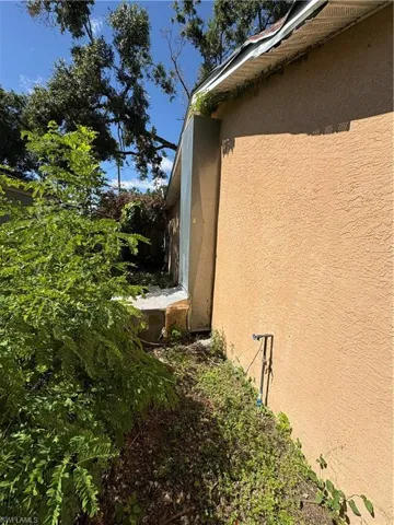 View of side of property with stucco siding