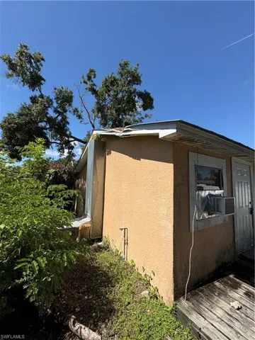 View of property exterior with stucco siding