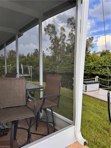 Sunroom with outdoor dining area