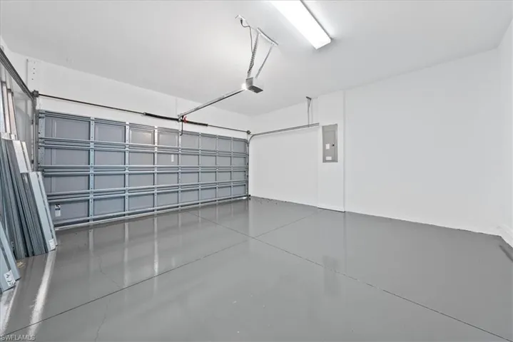 Garage featuring a garage door opener