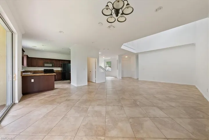 Unfurnished living room with a skylight