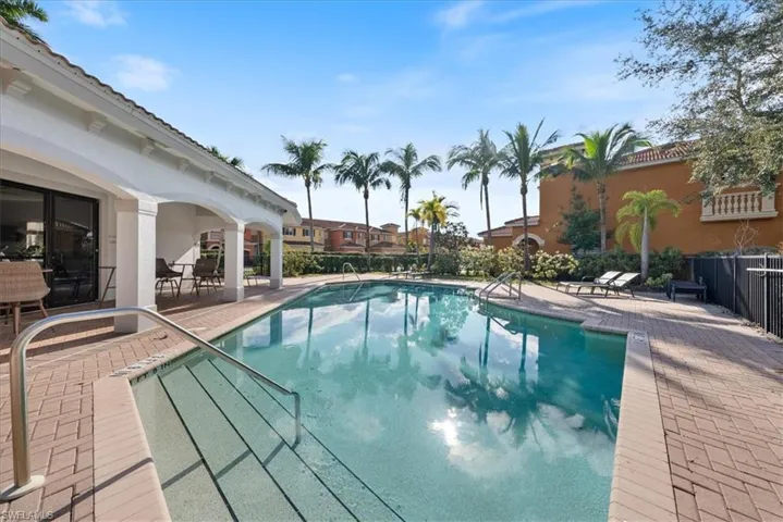 View of swimming pool with a patio area