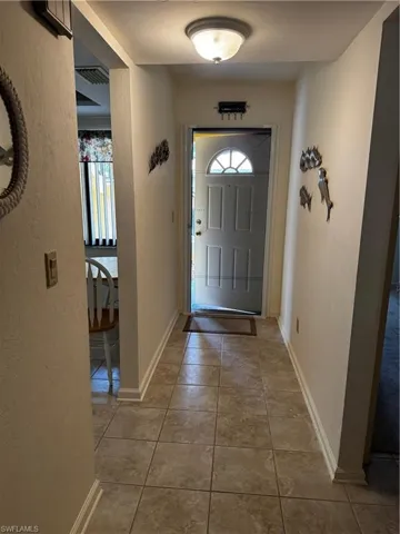 hiding screen door! tiled entry, kitchen hallway and utility plus bathrooms.