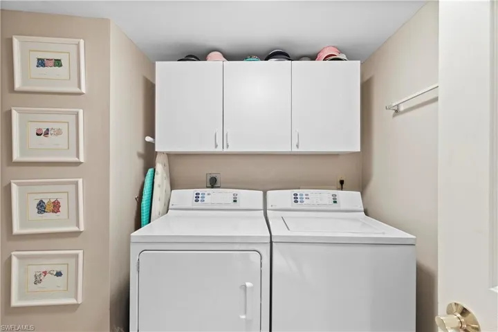 Laundry area with additional storage space to the left