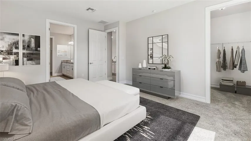 Carpeted bedroom with ensuite bathroom
