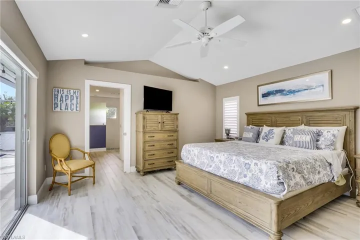 Bedroom featuring access to outside, ceiling fan, light wood-style floors, and recessed lighting