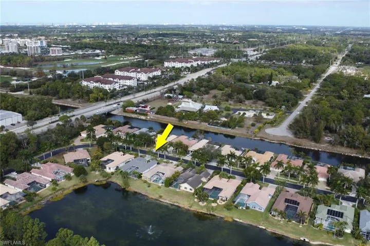 Aerial overview of property's location with a nearby body of water