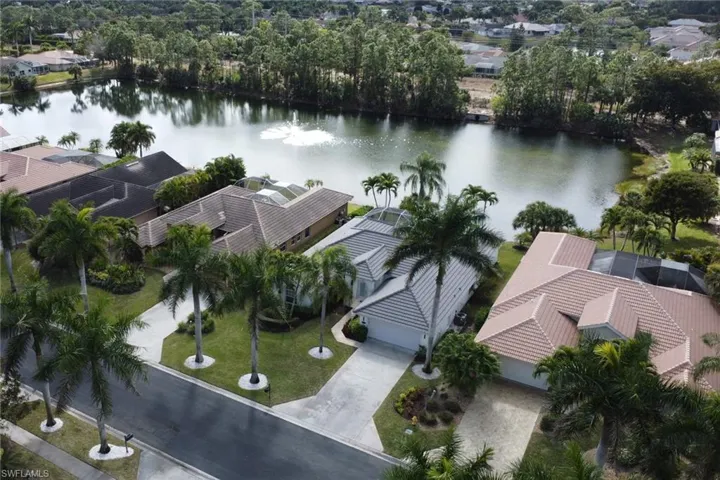 Aerial perspective of suburban area with a nearby body of water